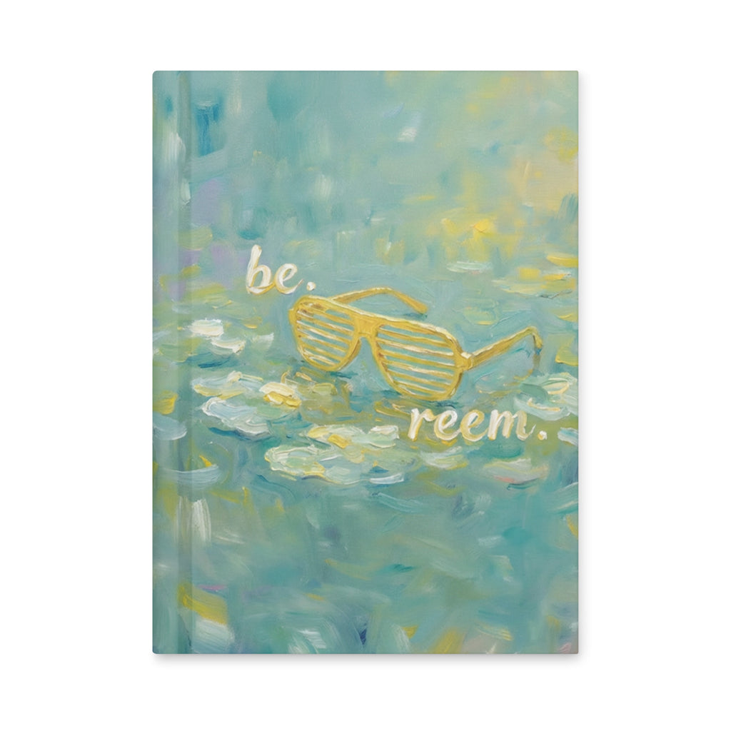 Be Reem Monet hardcover journal by Reem Tees, matte white, featuring a front view with a smooth finish and rounded corners.