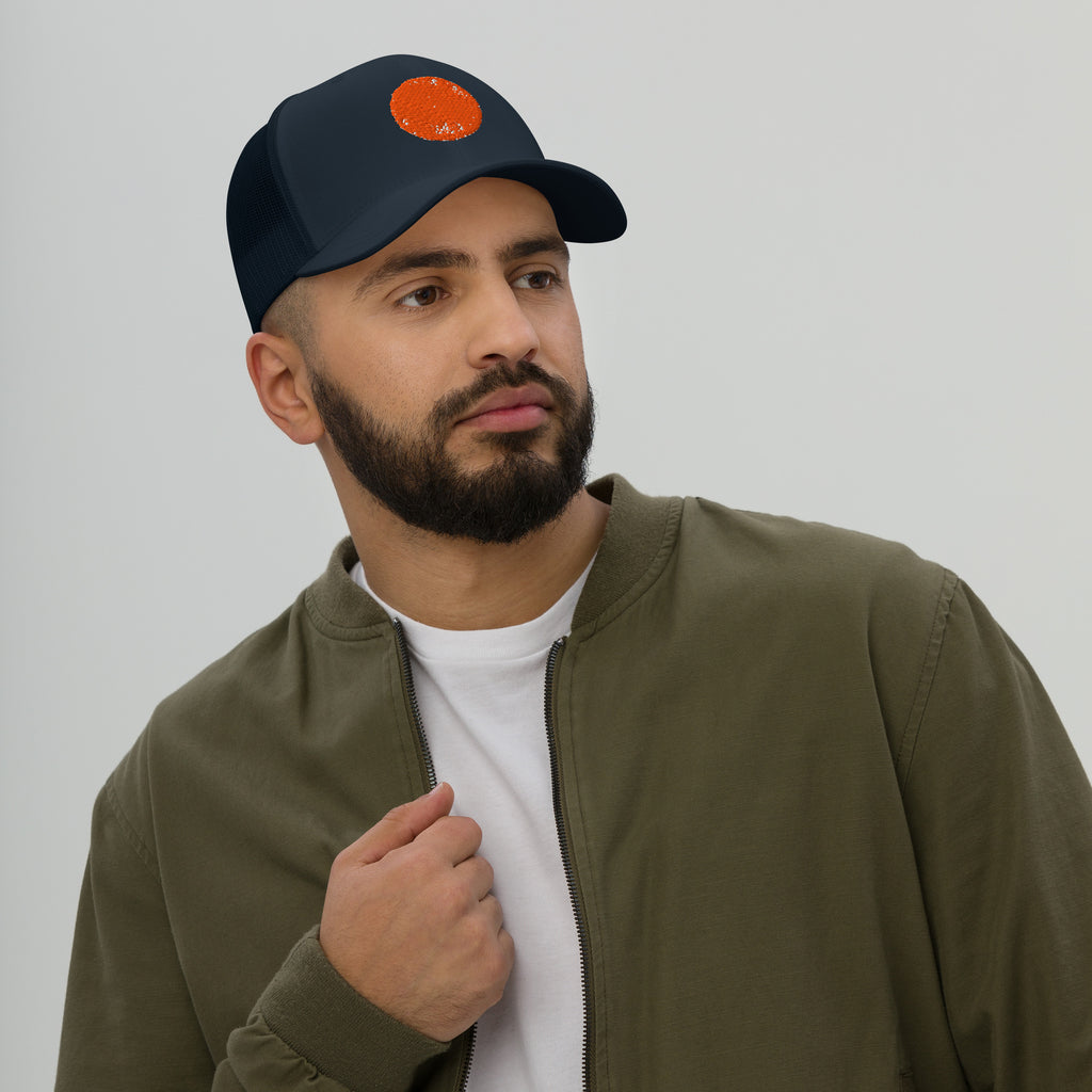 Navy Be Reem Circle Trucker Cap featuring a classic retro design with a breathable mesh back and adjustable snap closure.
