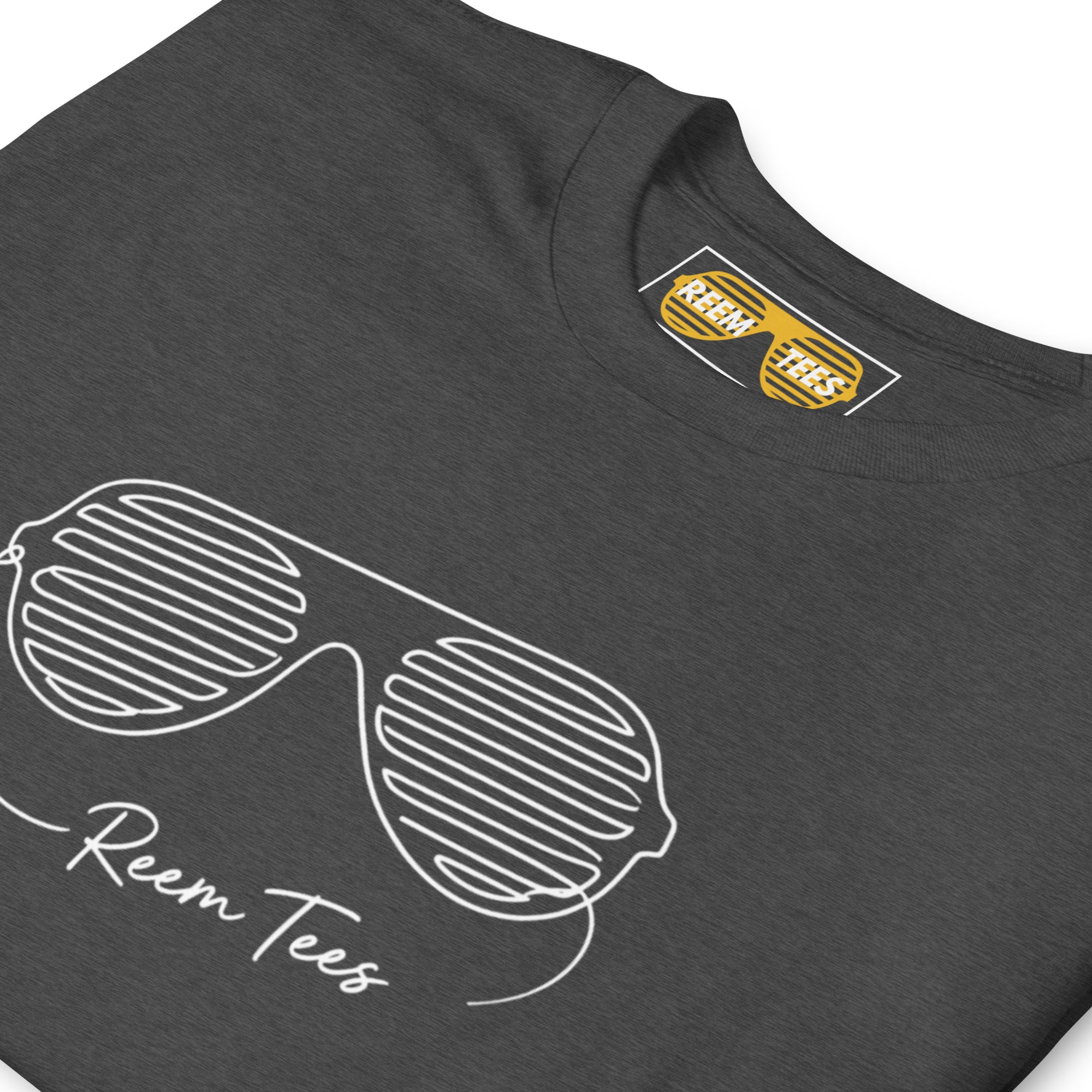 Dark heather grey Reem Tees short-sleeve unisex t-shirt featuring a light line art logo design.