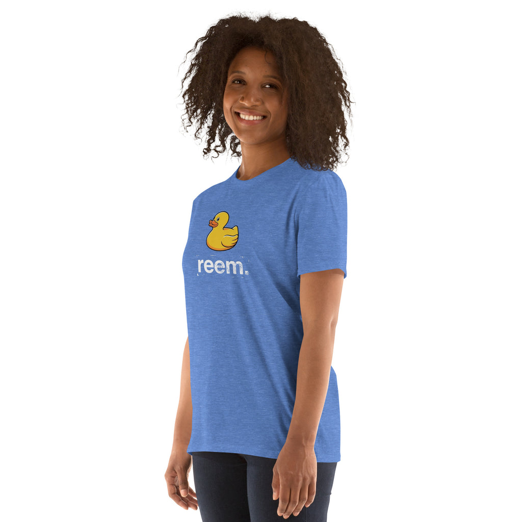 Unisex classic tee in heather royal featuring Ducks Are Reem light logo by Reem Tees, shown from the left front.