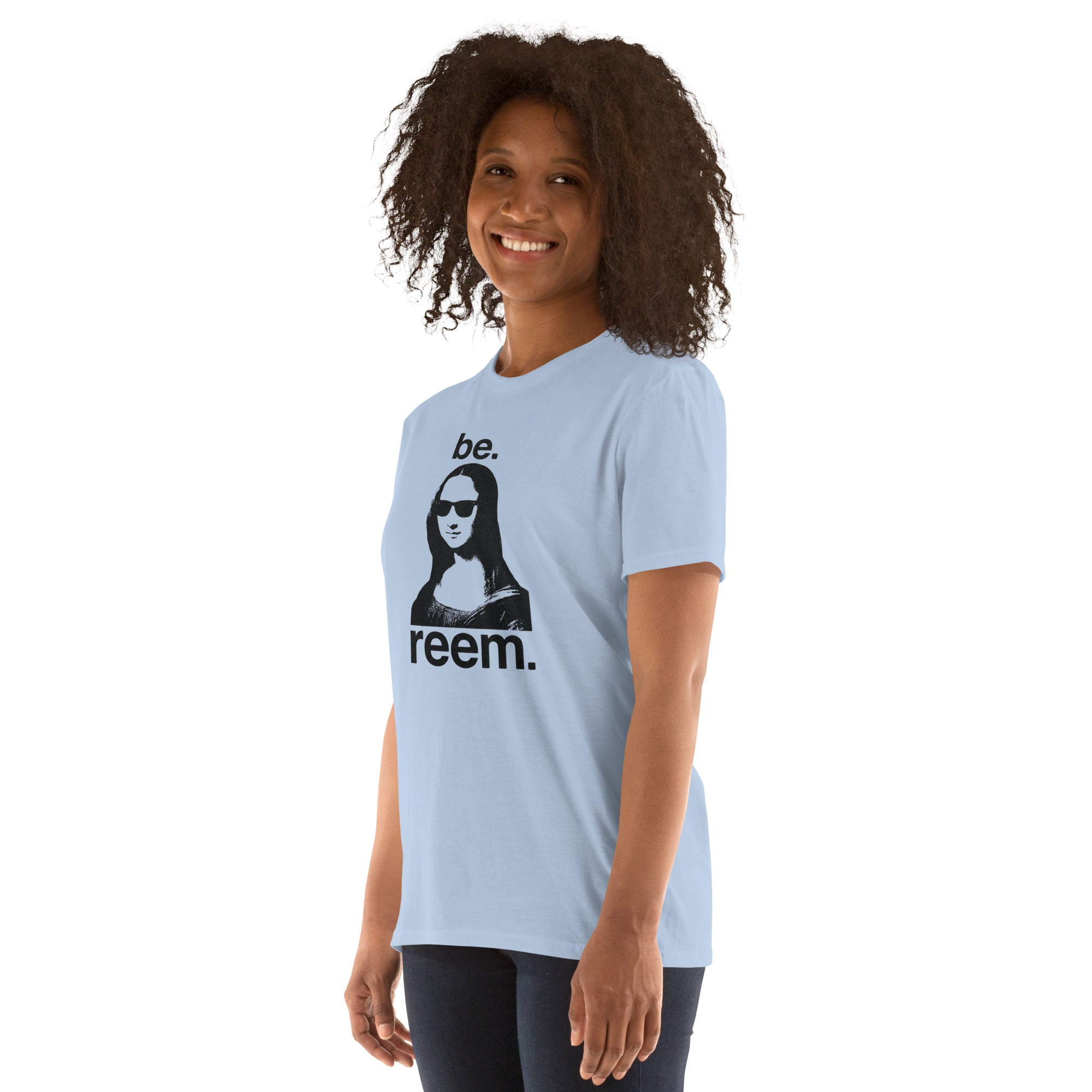 Light blue unisex classic tee featuring Mona Lisa design by Reem Tees, displayed from the left front angle.
