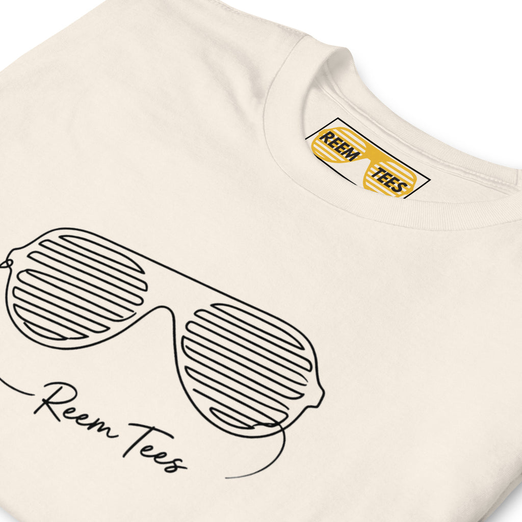 Classic unisex tee by Reem Tees featuring dark line art logo on a natural softstyle fabric.