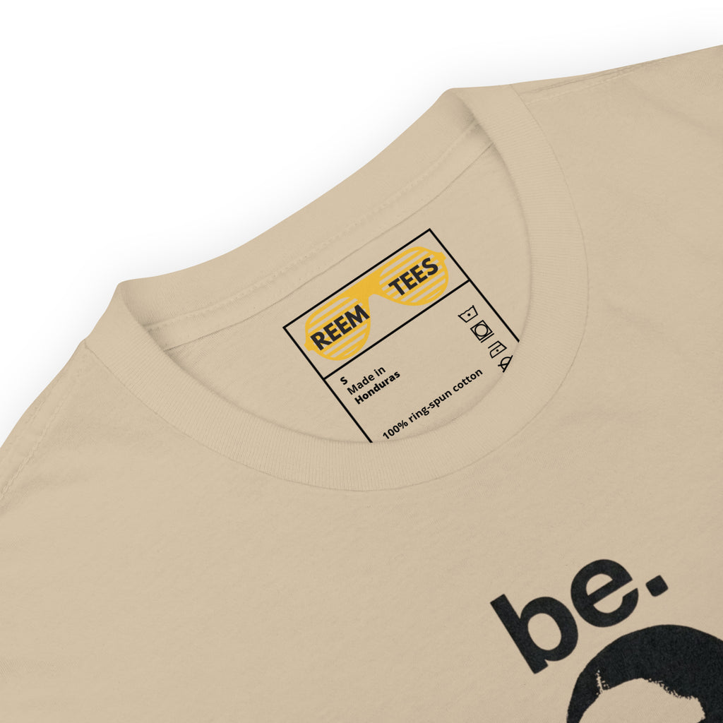 Be Reem Mona Lisa CLASSIC unisex tee in sand color, featuring softstyle fabric and a relaxed fit.