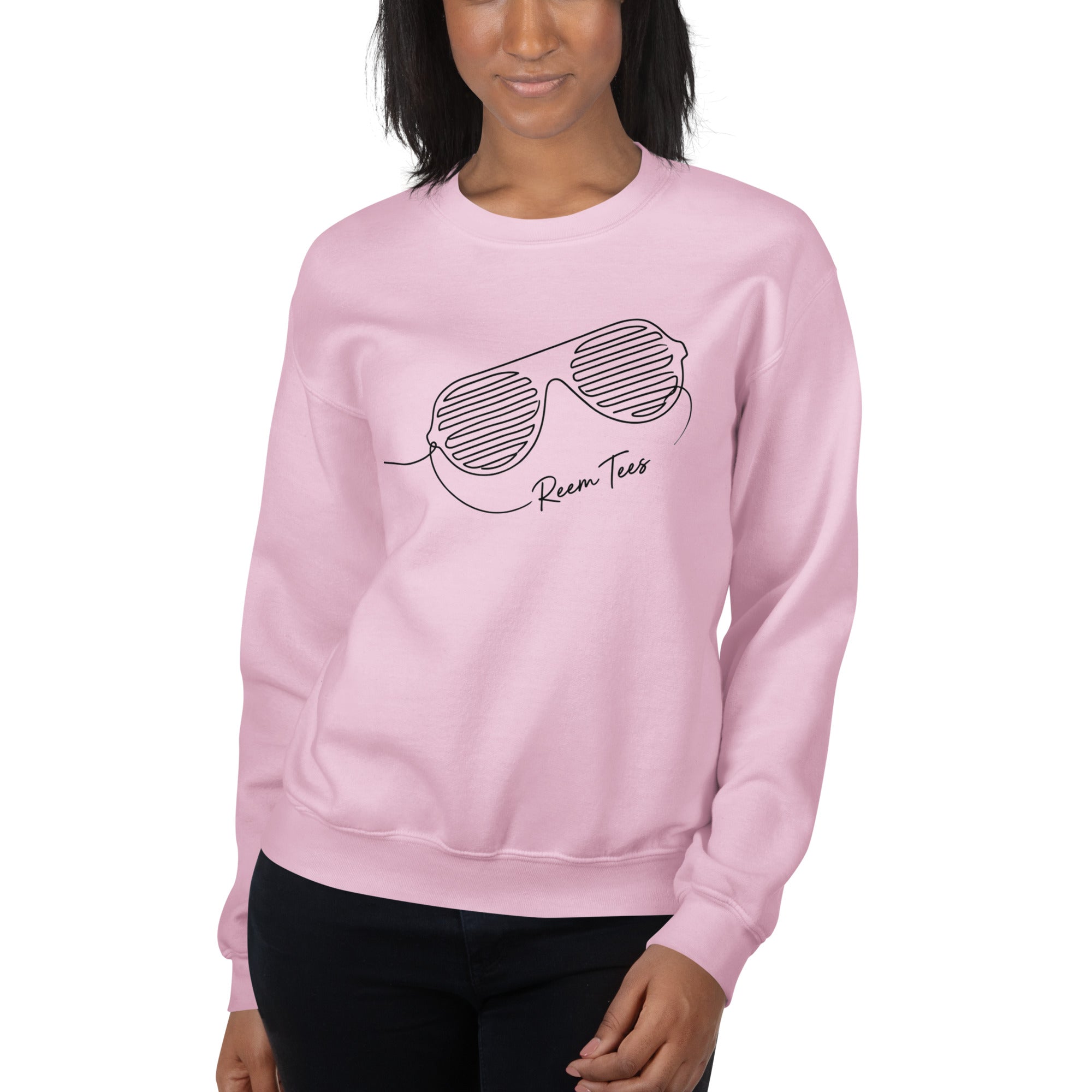Light pink unisex crew neck sweatshirt featuring Be Reem line art design from Reem Tees.