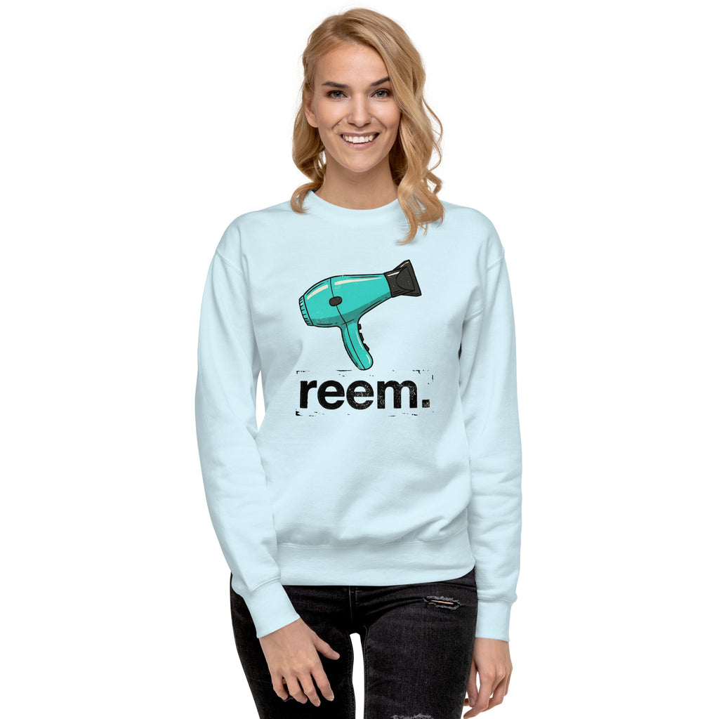 Sky blue unisex sweatshirt featuring "Hairdryers Are Reem" text design by Reem Tees, displayed from the front.